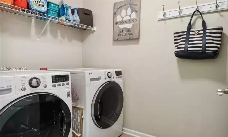 Laundry area with washer and clothes dryer