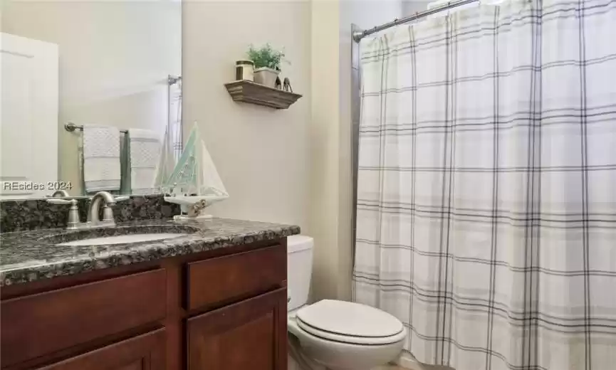 Bathroom featuring toilet and oversized vanity