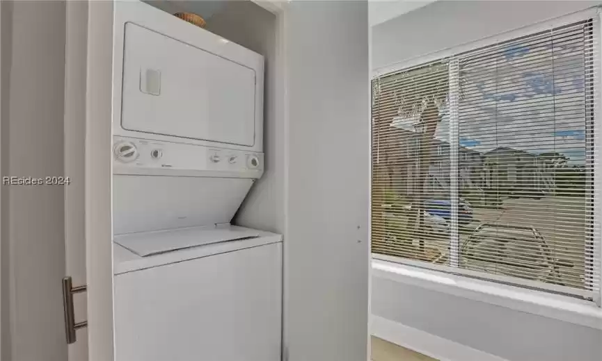 Concealed stackable washer / dryer in kitchen.