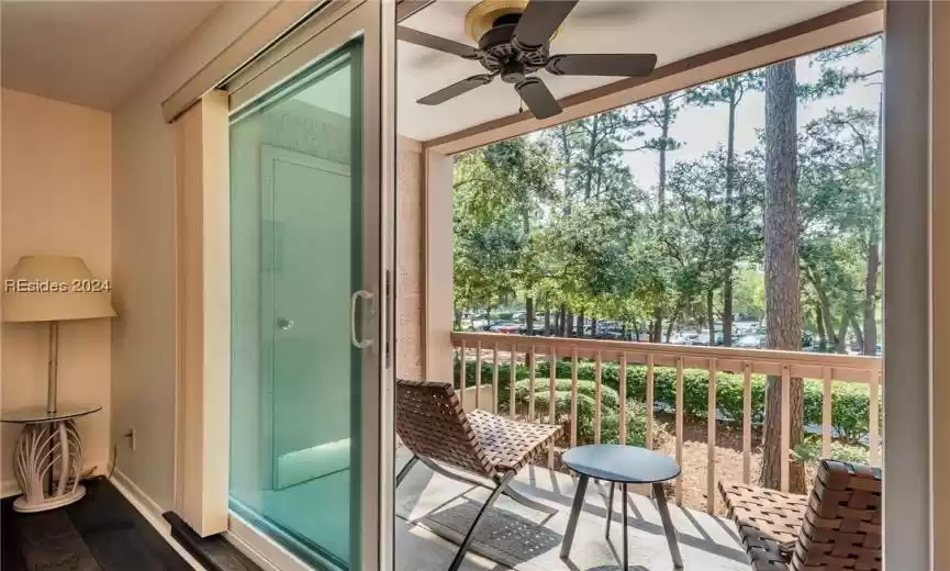 Covered porch with storage room and views across the street to the Harbour Town golf course.