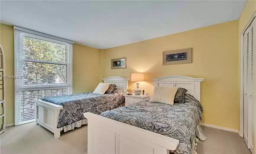 Third bedroom boasting a coastal theme.