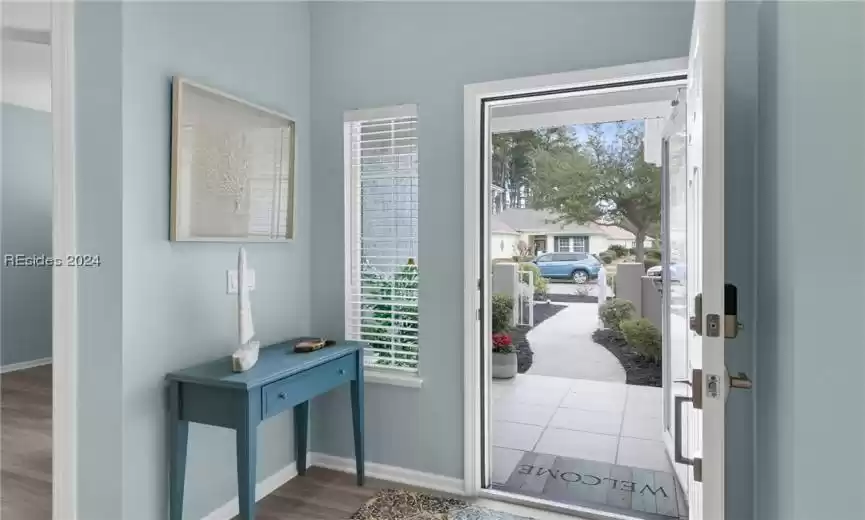 Doorway to outside with hardwood / wood-style flooring