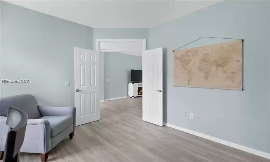 Living area with light hardwood / wood-style floors