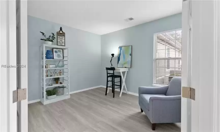 Living area featuring light hardwood / wood-style floors