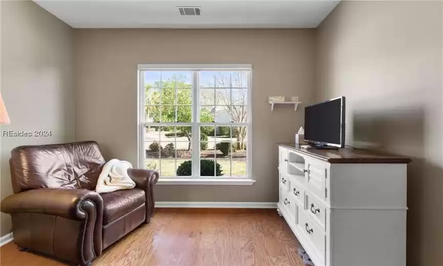 Sitting room featuring light hardwood / wood-style floors