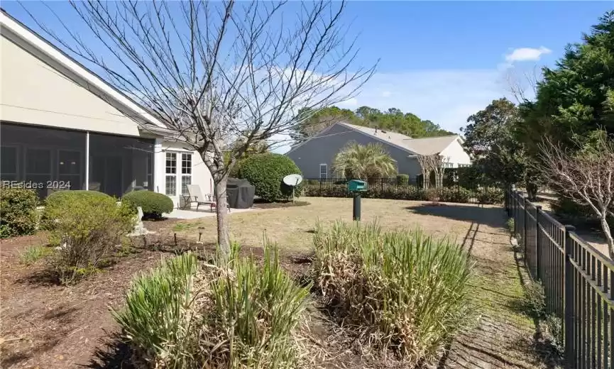 View of yard with a sunroom