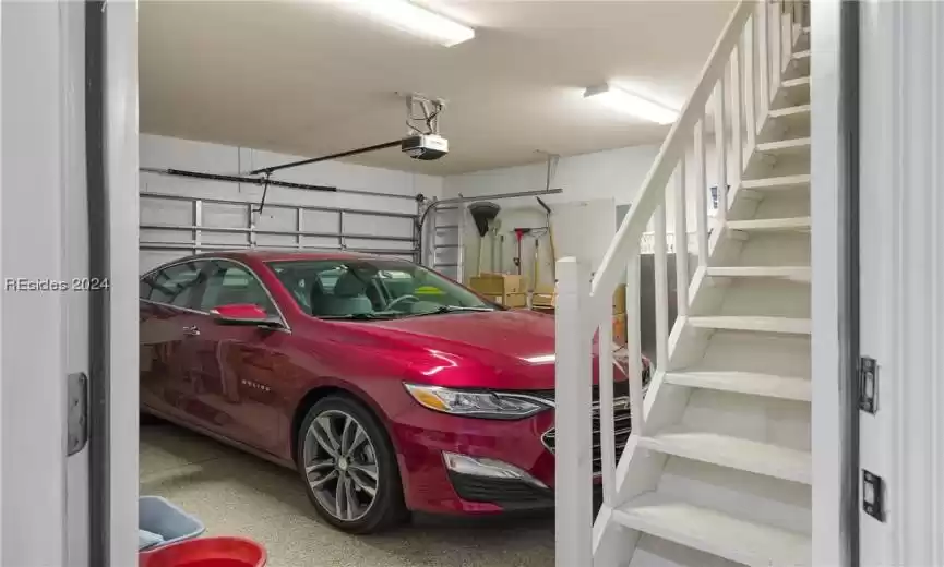Garage featuring a garage door opener
