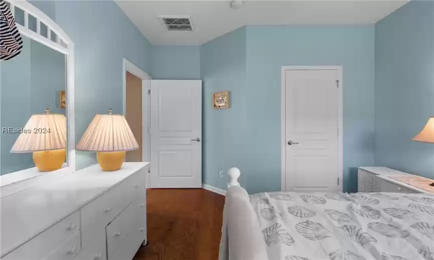 Bedroom featuring dark hardwood / wood-style flooring