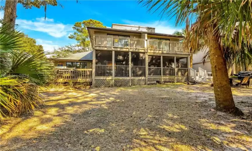Back of property with a balcony