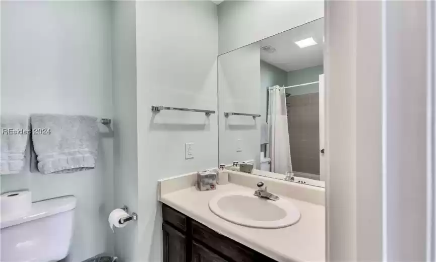 Bathroom featuring vanity and toilet