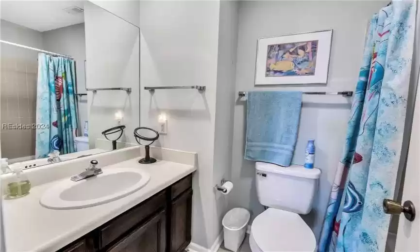 Bathroom with toilet and vanity
