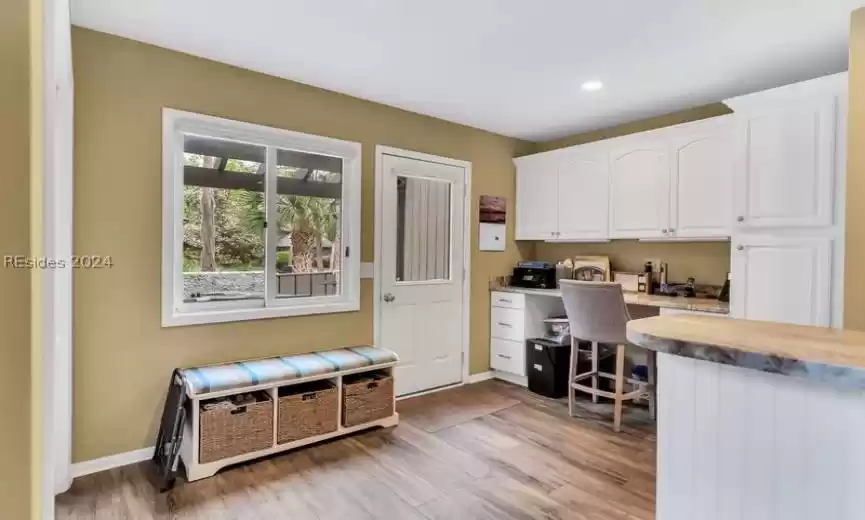 built in desk with stone top at eat in kitchen area