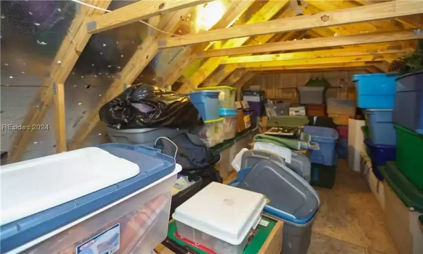 View of unfinished attic storage.