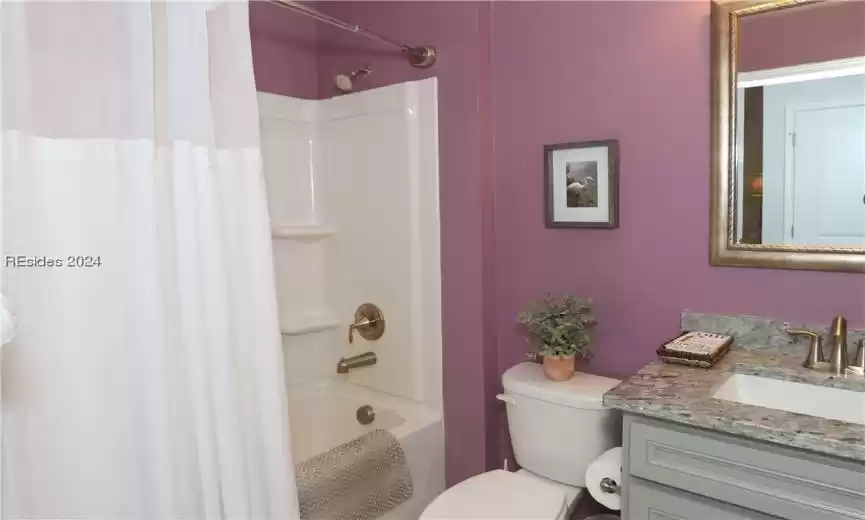 Full guest bathroom with tub shower and comfort-height vanity with upgraded granite counters and undermounted sink.