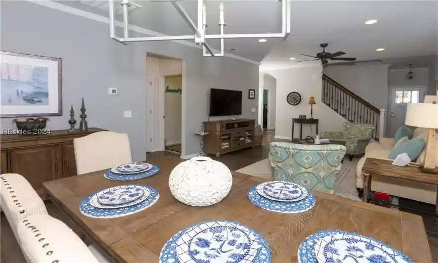 Dining area view towards the stairs to the bonus room level which shows the upgraded stair railing.