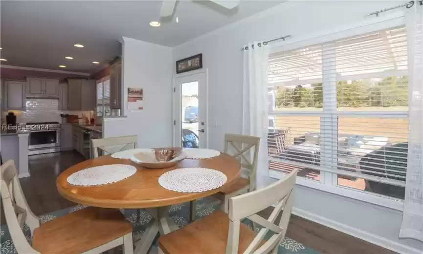 The Carolina Room has a private view of the paver patio and wooded landscaped berm.