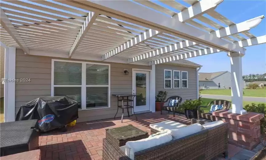View of patio featuring a grill, a natural gas stub for a grill and an aluminum pergola