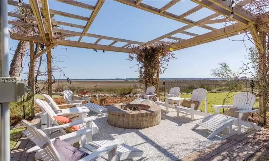 One of many serene spaces.  This is a firepit over looking marsh and the May River.