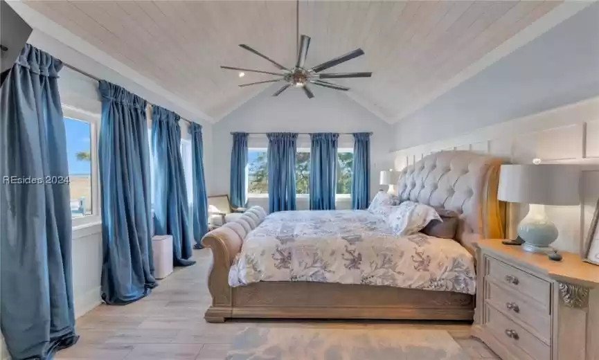 Master bedroom with cathedral ceiling and fan
