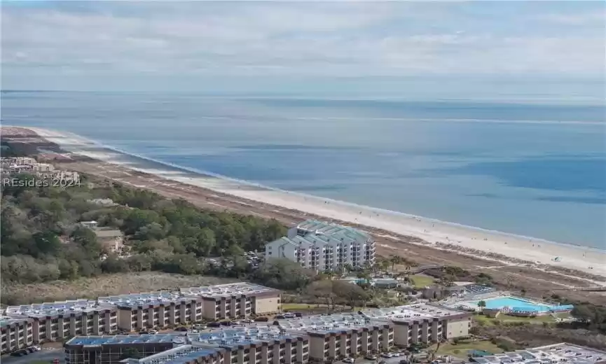 Aerial view featuring a view of the beach and a water view