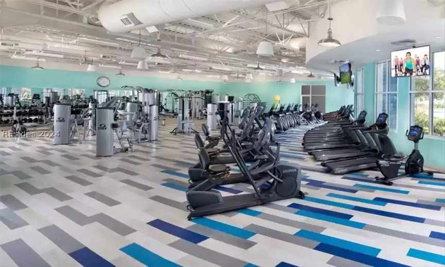 Workout area with light colored carpet