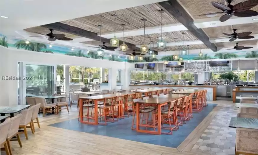 Dining room featuring beamed ceiling and ceiling fan