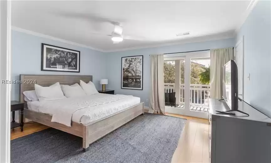 Bedroom with crown molding, access to outside, ceiling fan, and light hardwood / wood-style flooring