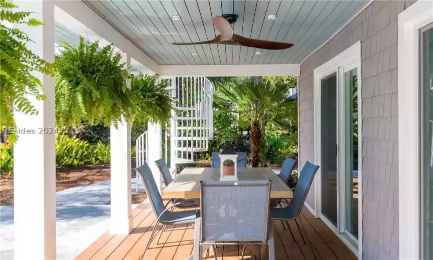Wooden deck featuring ceiling fan