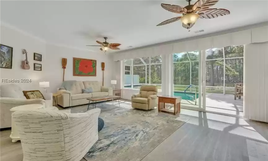 Main living area with sliders going out to screened pool