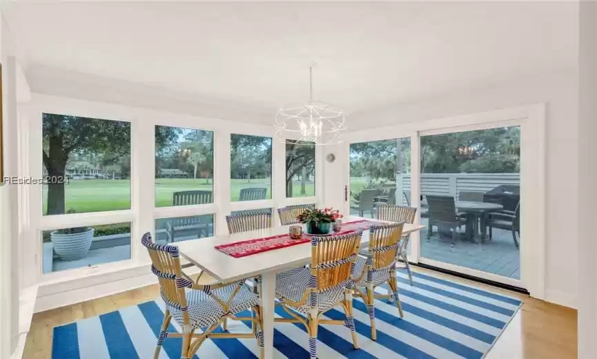 Dining area featuring light hardwood flooring and lots of natural light. Easy flow to deck for entertaining and viewing golf.