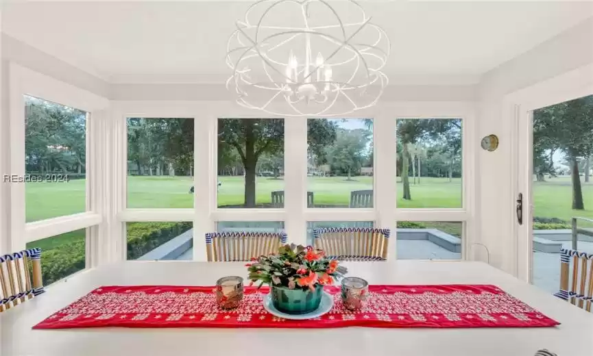Dining area featuring chandelier and views of 10th Green and Fairway of Harbour Town Golf Links