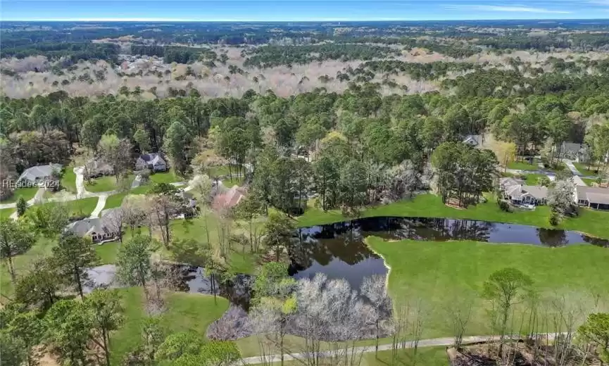 Aerial view of golf course and rear of property