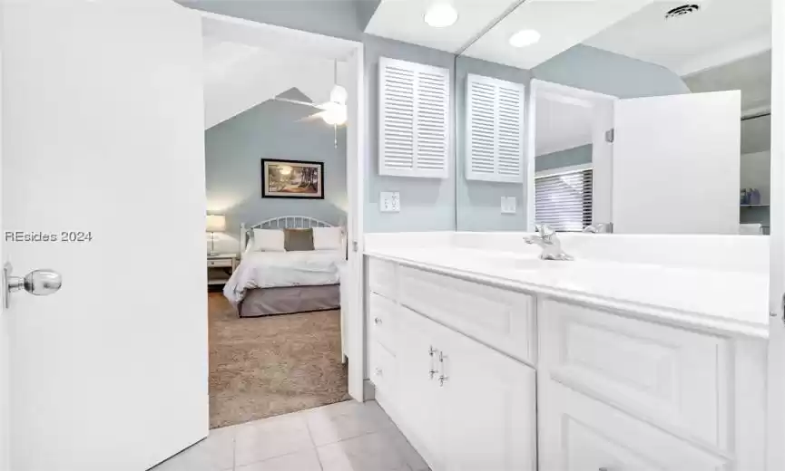 Bathroom with vanity and tile floors