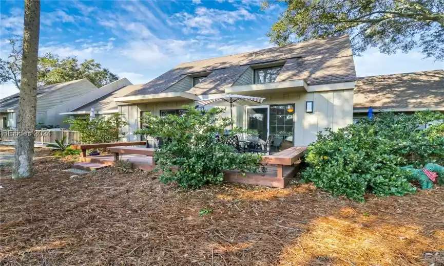 View of front of property featuring a wooden deck