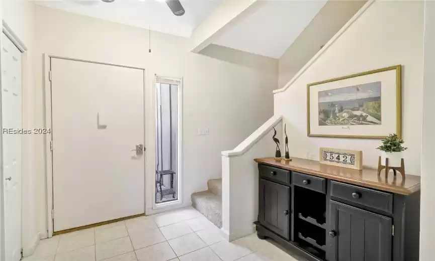 Tiled entryway with ceiling fan