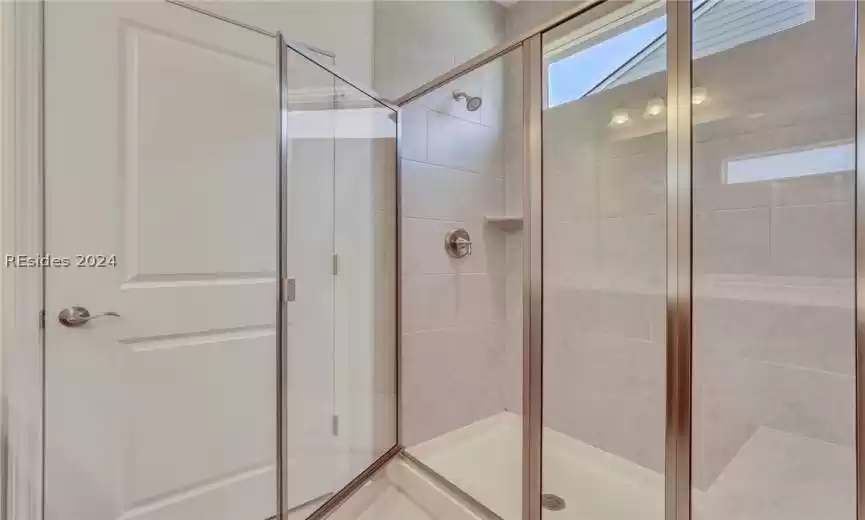 Primary bathroom featuring walk in shower
