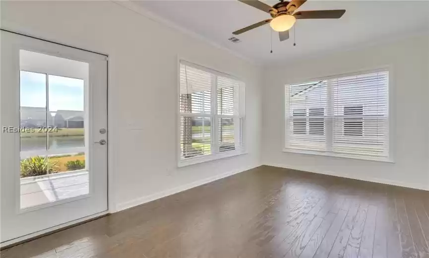 Carolina Room with plenty of natural light and lighted ceiling fan