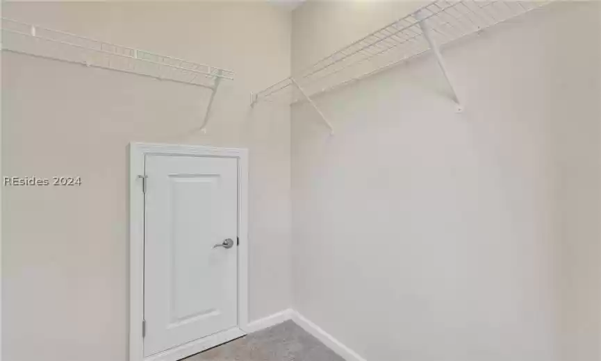 Spacious closet in guest quarters could be used as additional storage area in addition to using it as clothes closet