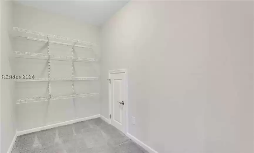 Large storage closet at the top of the stairs on the second floor