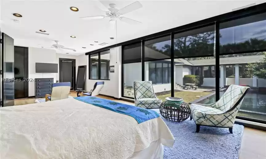 Bedroom featuring access to outside, ceiling fan, and light wood-type flooring