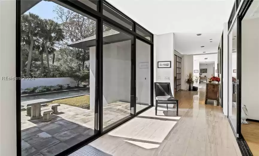Doorway with dark wood-type flooring
