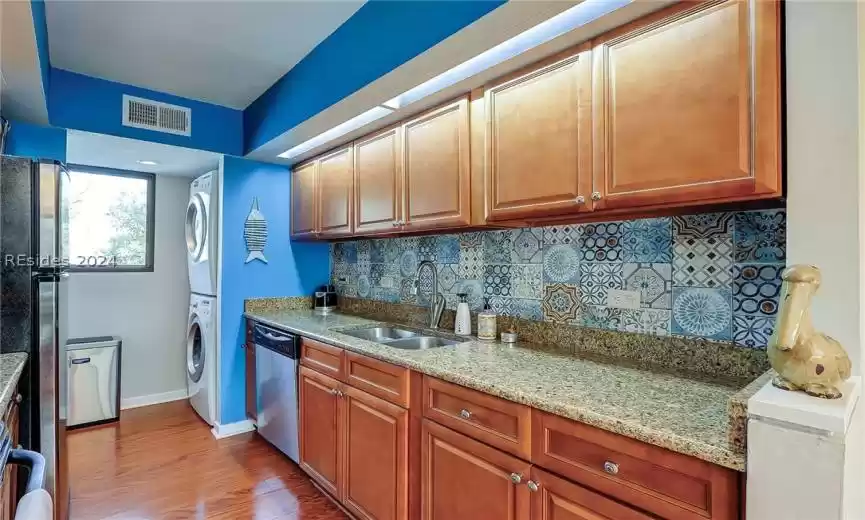 Kitchen with Granite Countertops and Stainless Steel Appliances; Full Size Washer & Dryer