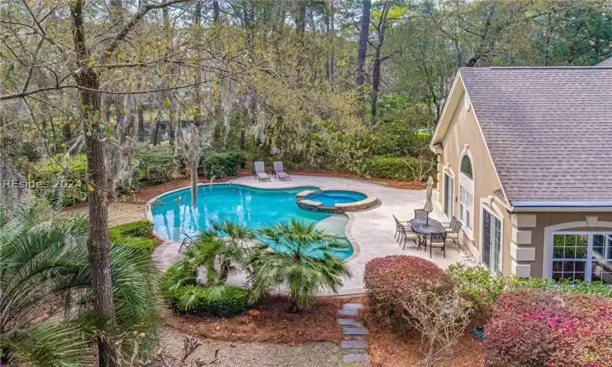 View of pool featuring a patio area and an in ground hot tub