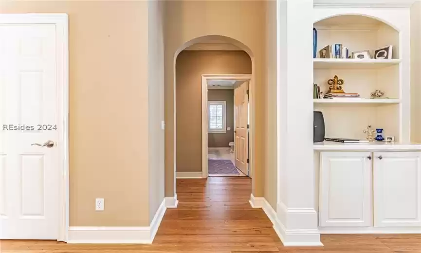 Corridor featuring light wood-type flooring