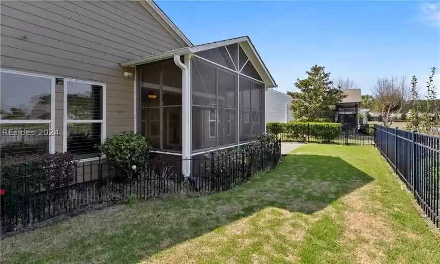 View of yard featuring a sunroom