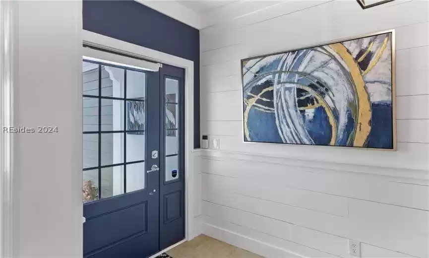Doorway with light tile flooring