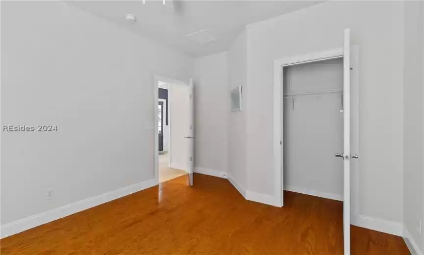 Unfurnished bedroom with a closet and light hardwood / wood-style flooring