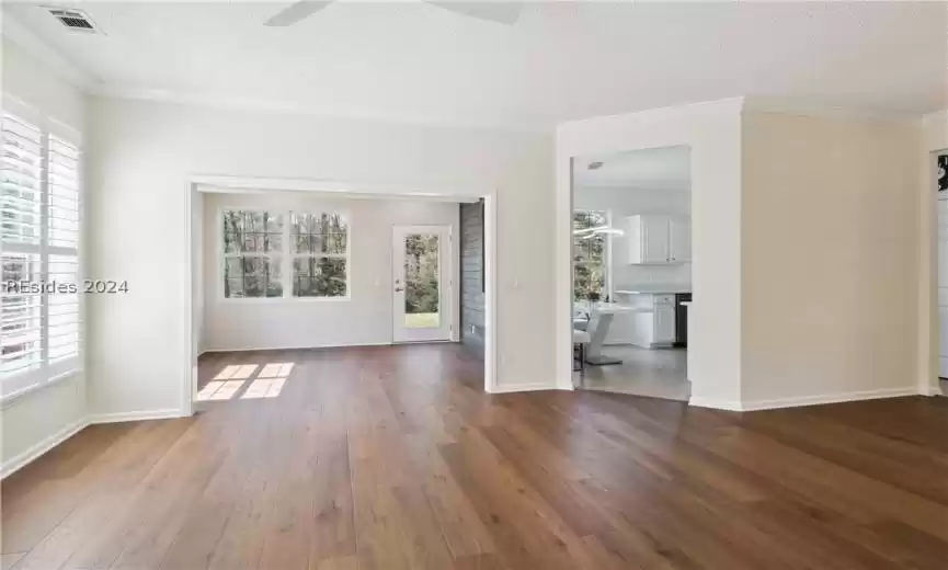 Unfurnished room featuring a textured ceiling, hardwood / wood-style floors, and ceiling fan