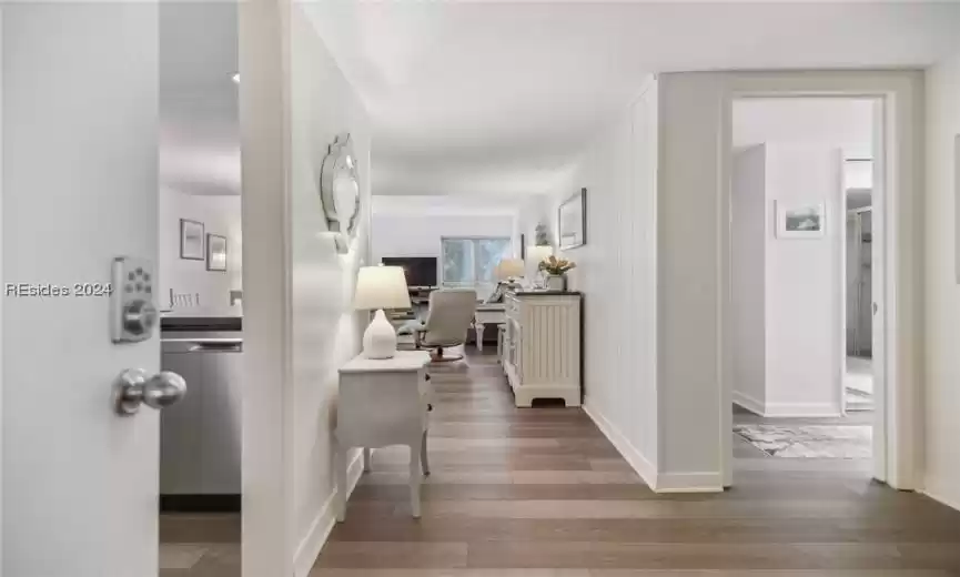 View upon entry.  Welcome home to easy luxury vinyl flooring, and beach themed accents.