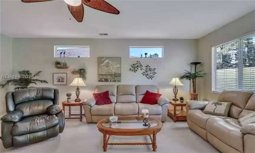 Ample seating with sliders leading to the covered patio